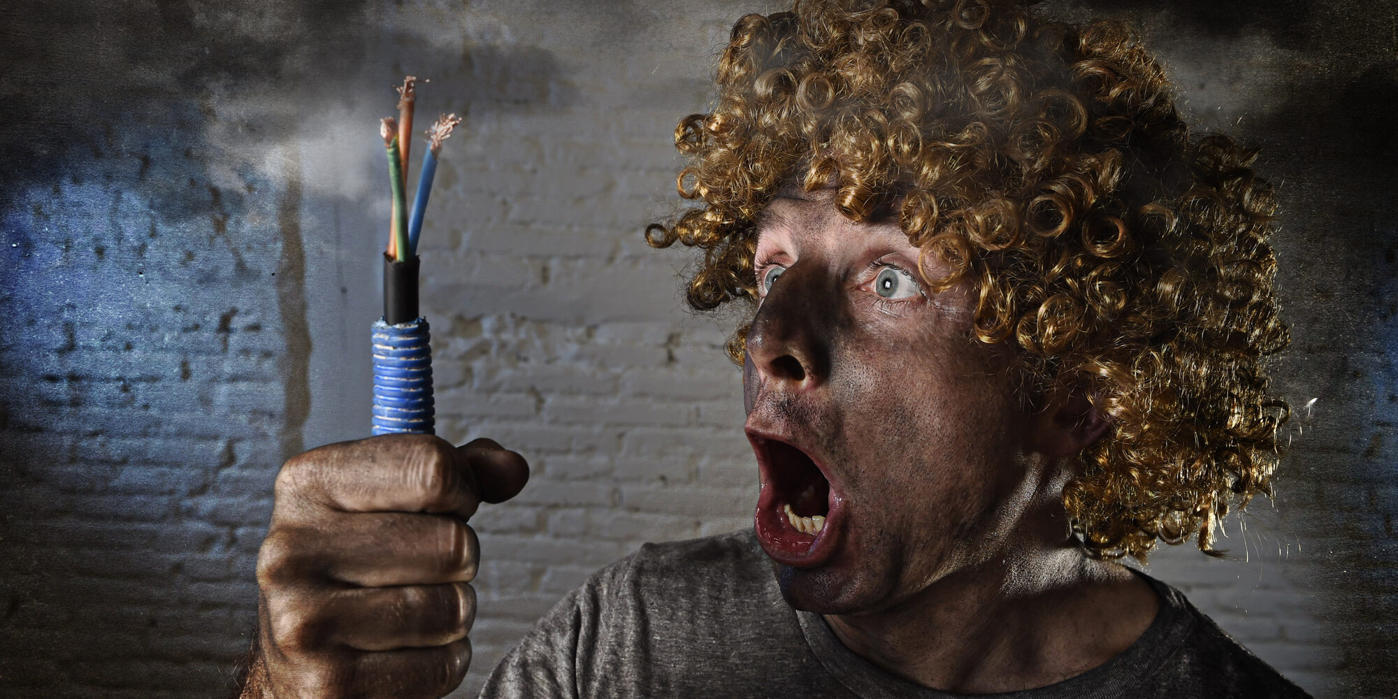 man with cable smoking after domestic accident with dirty burnt face shock electrocuted expression DIY Business sale can cost you big